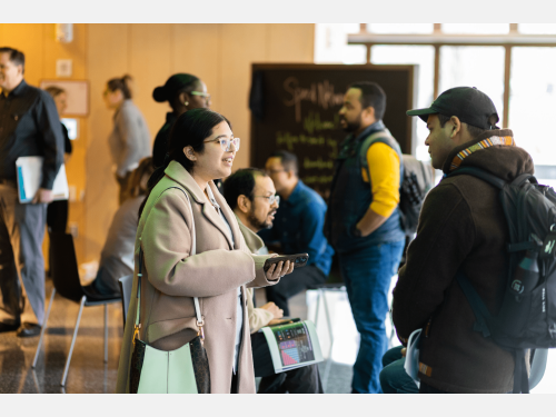 Photo of 2 people in conversation