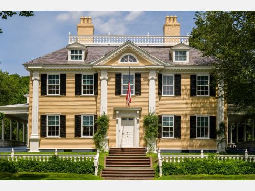A yellow, Georgian mansion. 