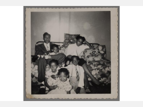 Two conservators work on respective artworks in their large laboratory space, which is illuminated by natural light.