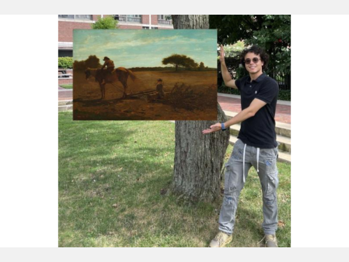 In this photomontage, a smiling young man stands next to a tree, gesturing toward a landscape painting that appears to float. In the foreground of the painting, two boys and a horse clear a large brown field. 