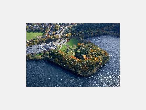 The Cambridge Water Works sitting on the edge of Fresh Pond Reservoir