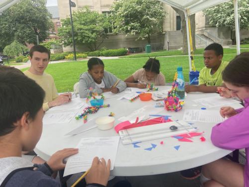 Children working on Math Circle activities with their teacher.