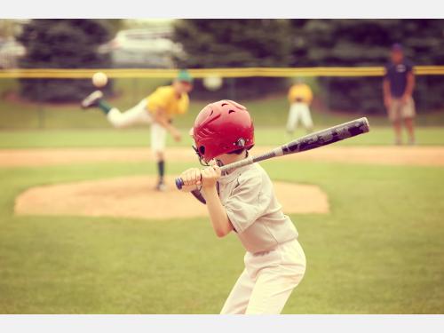 Photo of kids playing baseball.