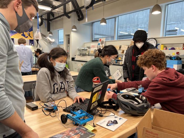 Photo of students building a robot.