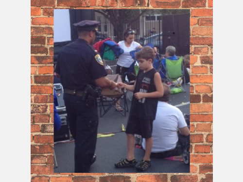 Photo of officer talking with youth.