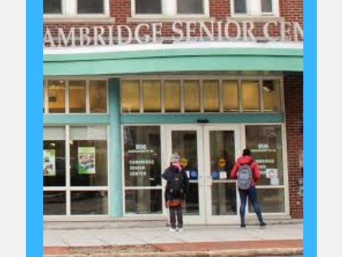 Photo of two students for free English classes for older adults entering the Citywide Cambridge Senior Center.