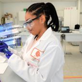 A young scientist using a pipette. 